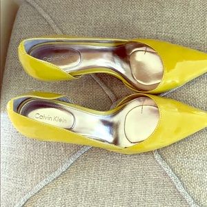 Barely worn and like new yellow/green high heels.
